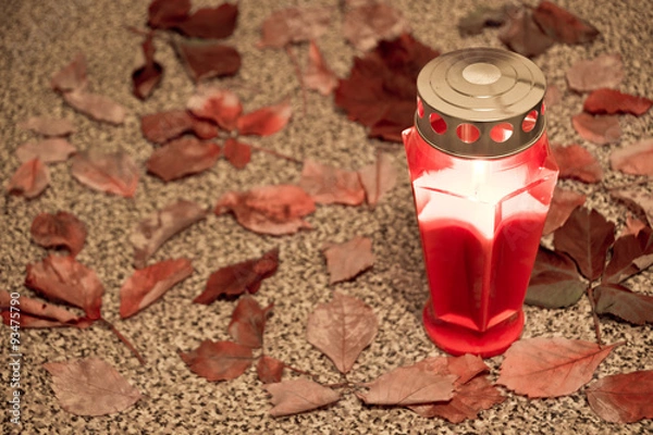 Obraz cemetery red lantern candle with autumn leaves 