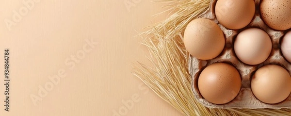 Fototapeta Fresh eggs in a rustic setting with straw, perfect for cooking and baking concepts