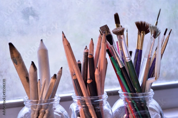 Fototapeta Three jars with fine art tools. Paintbrushes, pencils and tortil