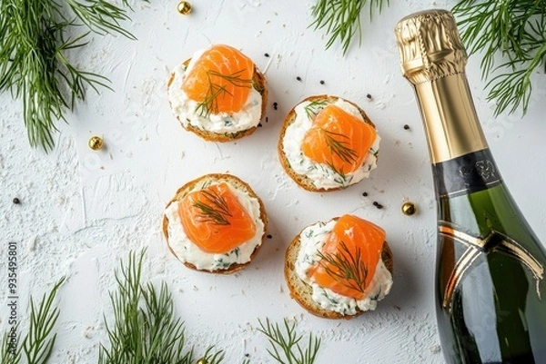 Fototapeta Bottle of champagne, salmon canapes with cream cheese and dill on the side, on a white background, high resolution photo.