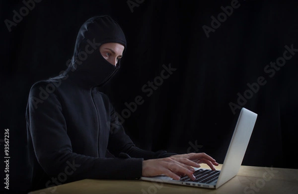 Obraz hacker at work with graphic user interface around