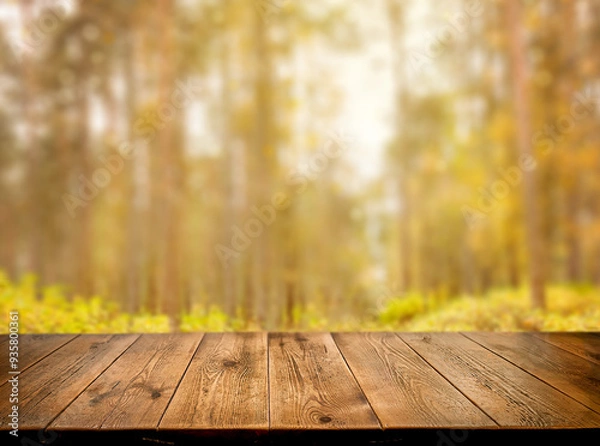 Fototapeta A natural, autumnal background. Empty wooden surface, table, wooden. The backdrop. Against the background of an autumn forest. The sun's rays. Bokeh. Summer, autumn day. Copy space