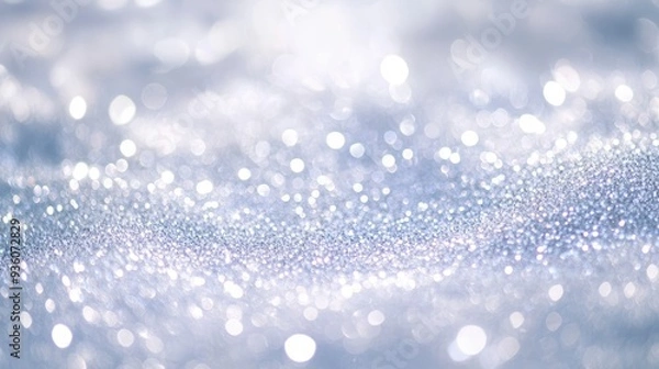 Fototapeta Blurry white glitter background with soft sparkles and glowing highlights, leaving space for text. Ideal for winter, wedding, or luxury themes.