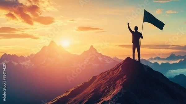 Obraz Silhouette of man standing on top mountain with flag in hand and celebrating success, sunrise sky background.