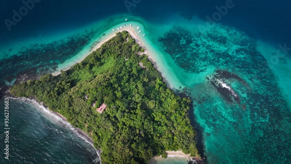 Fototapeta Aerial view of Nosy Tanikely Island in Madagascar showcasing its lush greenery and vibrant turquoise waters