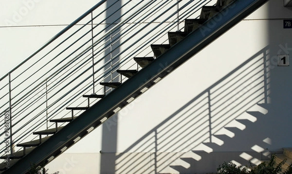 Fototapeta Detail of the geometric stairs of a building located at the Nati