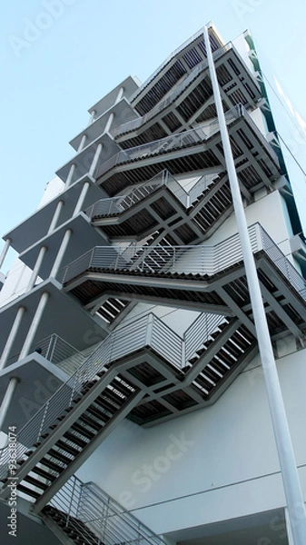 Fototapeta Detail of the geometric stairs of a building located at the Nati