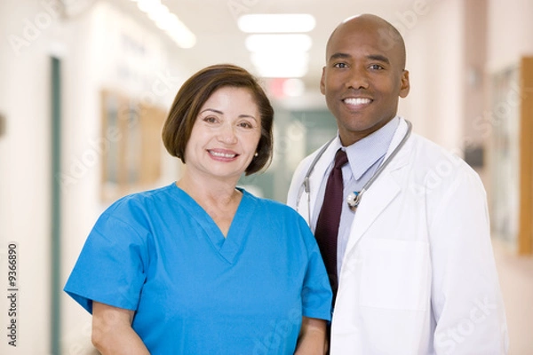 Fototapeta A Doctor And Nurse Standing In A Hospital Corridor