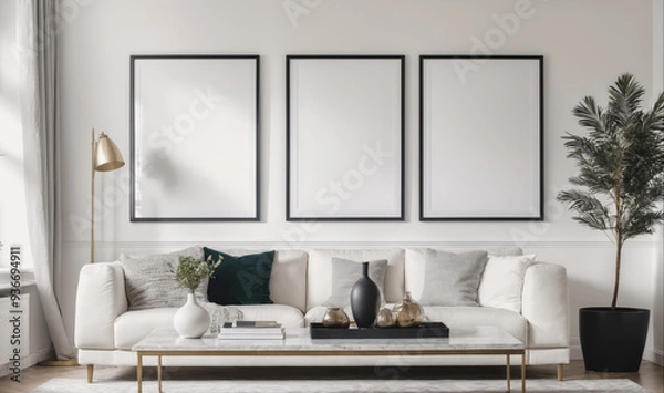 Fototapeta A white sofa with pillows sits in a modern living room