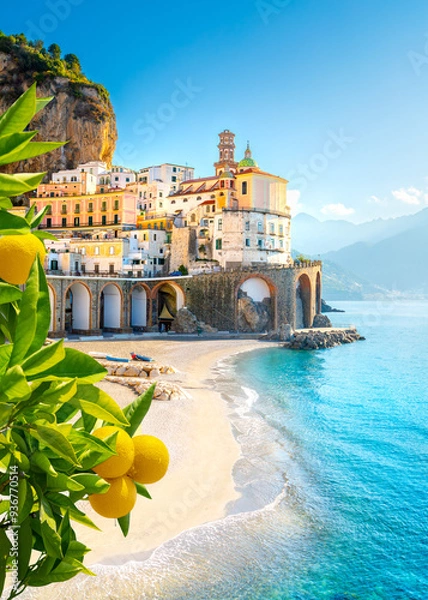 Fototapeta Beautiful view of Amalfi on the Mediterranean coast with lemons in the foreground, Italy