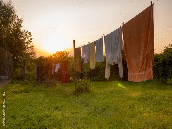 Fototapeta White laundry is drying outside