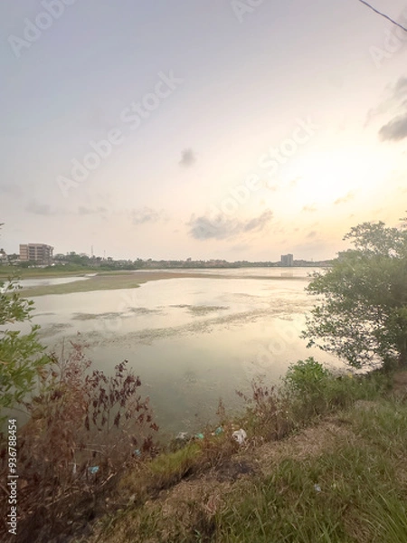 Fototapeta sunset over the river