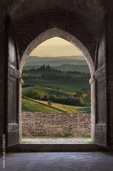Obraz Tuscan view through the arch entrance