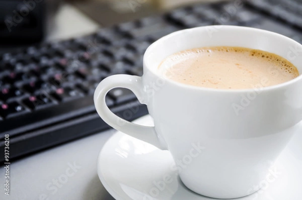 Fototapeta Coffee cappuccino, keyboard and mouse on the table