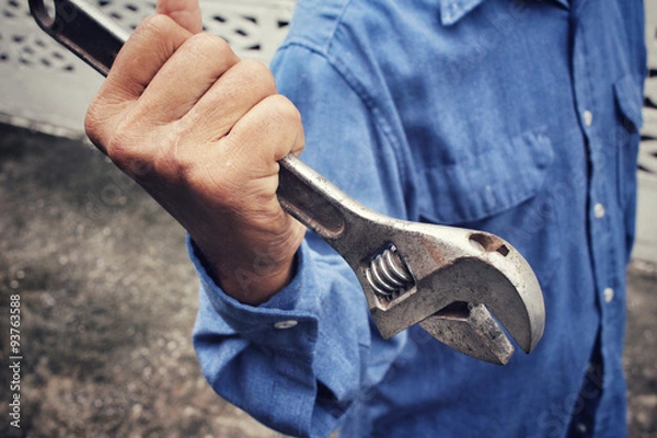 Fototapeta Man with adjustable wrench tool
