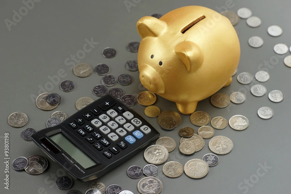 Obraz piggy bank with calculator.financial concept