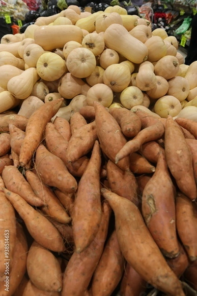 Fototapeta potatoes at the market,A pile of sweet potatoes and sweet potatoes for sale at a local vegetable market