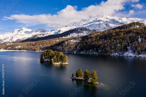 Fototapeta Lake Sils, Switzerland: Dramatic aerial view of lake Sils and the Corvatsch peak near St Moritz in the Swiss alps in winter