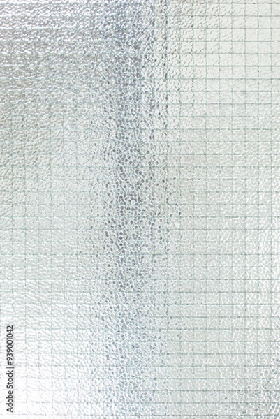 Fototapeta Drahtglasscheibe. Transparentes Sicherheitsglas mit geriffelter matter Oberfläche. Wired glass panel. Transparent safety glass with ribbed matt surface.