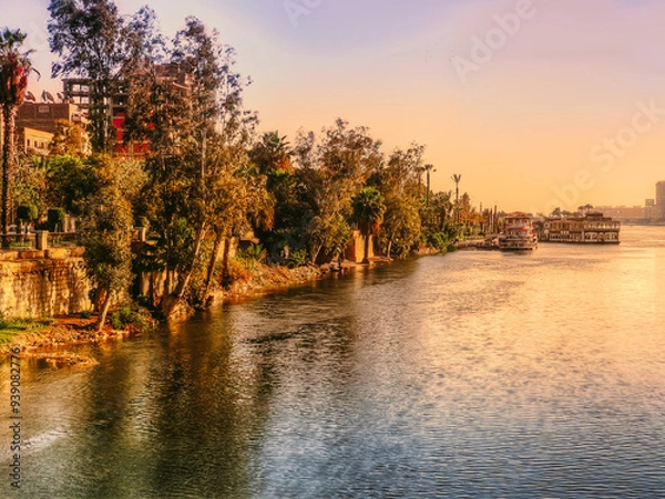 Fototapeta A view for the river Nile in the golden hour taken from El Manial district of Cairo, located on Rhoda Island in the Nile.