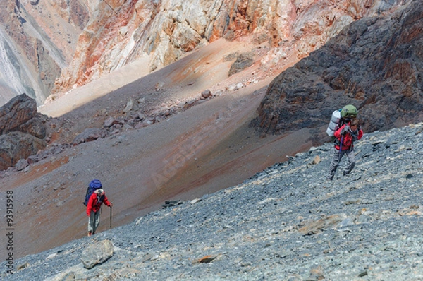 Obraz Two men climbing on the top.