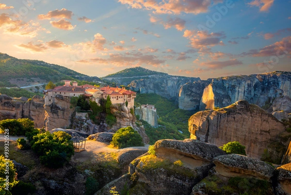 Fototapeta Meteora. Greece, Meteora Monasteries. Panoramic view of the Holy Monastery of Varlaam, located on the edge of a high cliff. Beautiful sunrise.  Greece, Europe