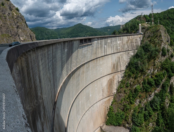 Fototapeta Crossing the impressive Vidraru Dam along the Transfăgărășan road (DN7C) in the Fagaras mountains, Transylvania, Romania