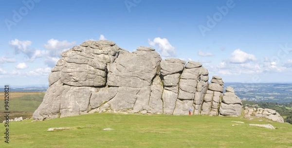 Obraz Climbers scale Haytor Rock on Dartmoor - Devon, England.