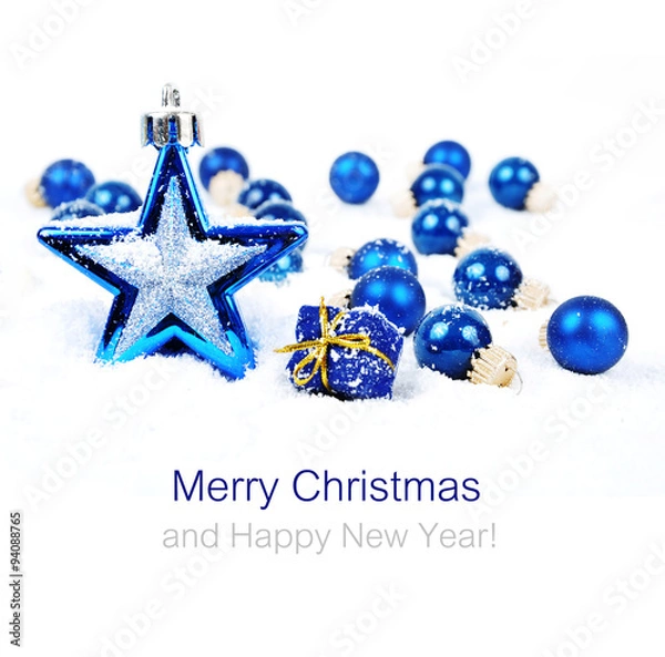 Fototapeta Colorful christmas decoration baubles on white with space for text
