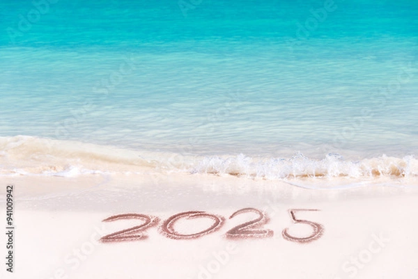 Fototapeta 2025 written on the sand of a tropical beach, travel new year card
