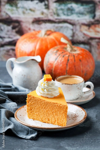 Obraz Piece of pumpkin cheesecake decorated with whipped cream, selective focus