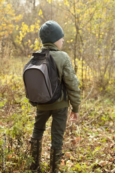 Fototapeta Boy-traveler with a backpack