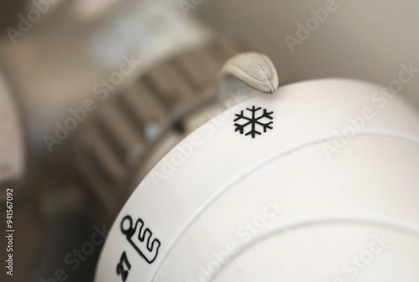Fototapeta thermostat control knob set to cold icon 
