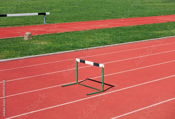 Fototapeta hurdle in athletic track field