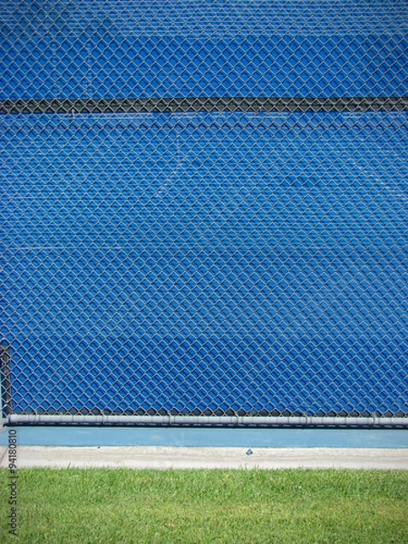 Obraz blue fence with green grass abstract design background