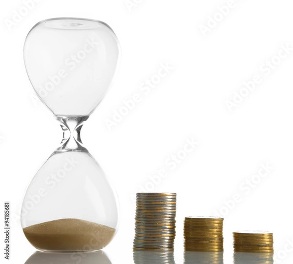 Fototapeta Hourglass with coins isolated on white