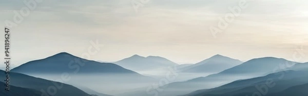Fototapeta Misty morning mountains with rolling hills and soft pastel sky
