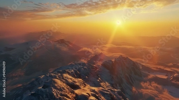 Fototapeta Stunning panorama of towering mountains with calm lakes under the warm light of the rising sun in the morning