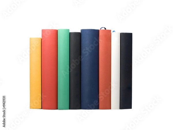 Fototapeta backs of eight books in various colors and sizes, isolated