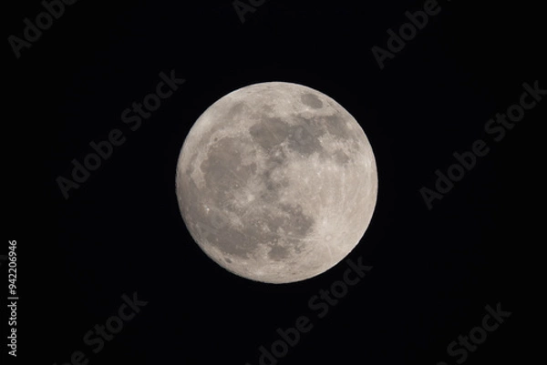 Obraz photograph of the full moon partially covered with clouds