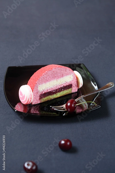 Fototapeta Piece of Cherry Lychee and Pistachio Yule Log Cake