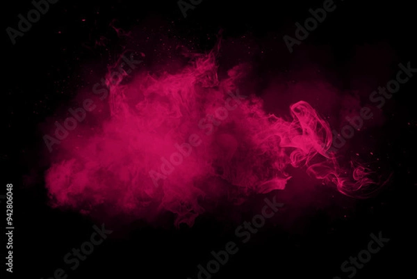 Obraz Pink powder explosion on black background.