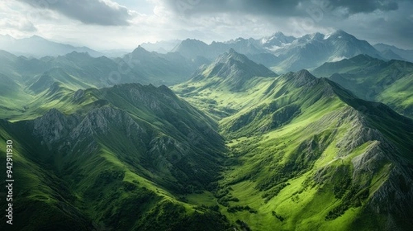Obraz Lush Green Mountain Ranges Under a Cloudy Sky