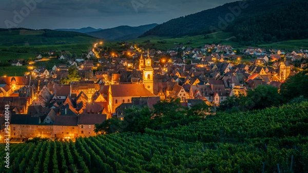 Fototapeta A beautiful night alsacian architecture pic taken in Riquewihr in France on August 20th 2024