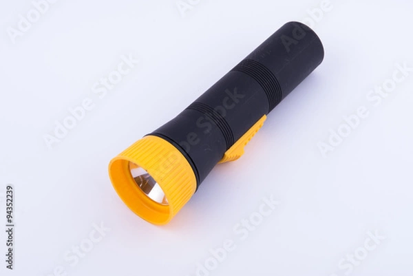 Fototapeta black and yellow torch on white background