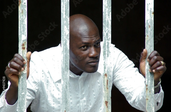 Fototapeta nachdenklich - hinter Gitter