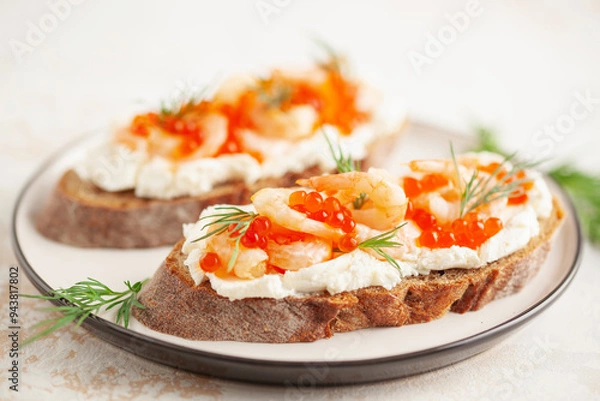 Fototapeta Toast skagen - shrimps and red caviar on bread. Classic swedish sandwich.