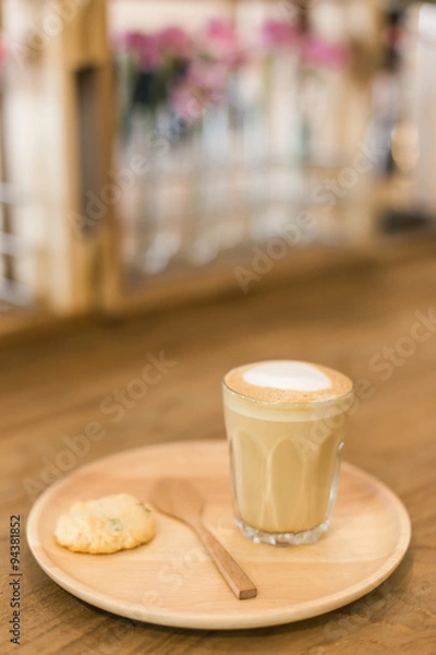 Obraz Hot art Latte Coffee in a cup on wooden table and Coffee shop bl