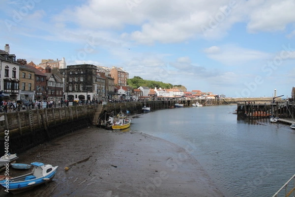 Obraz Whitby North Yorkshire UK 21st August 21 2024 Whitby a British seaside town  with boats moored in the harbour on a  hot summers
