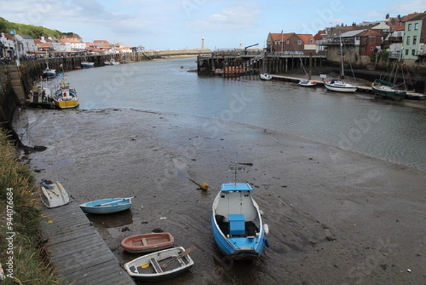 Obraz Whitby North Yorkshire UK 21st August 21 2024 Whitby a British seaside town  with boats moored in the harbour on a  hot summers